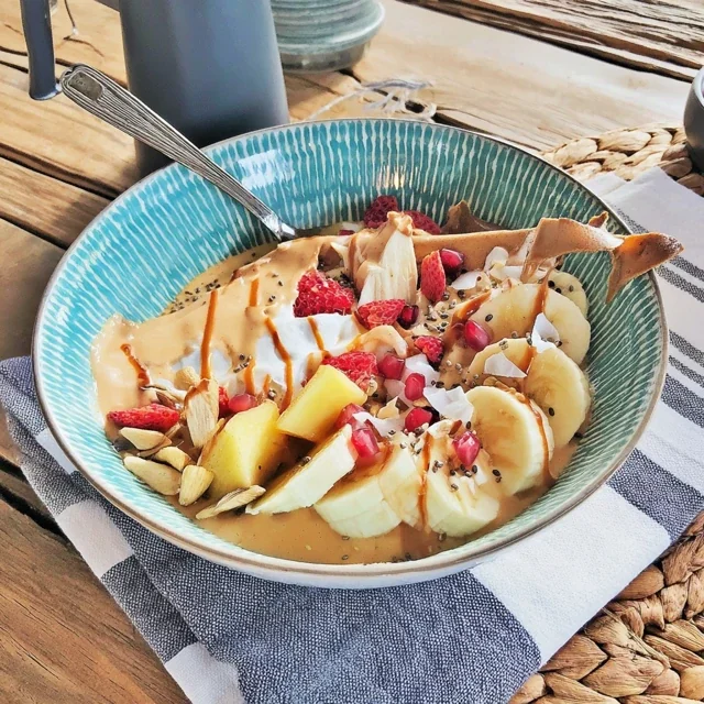 Delicious Tropical Mango and Banana Smoothie Bowl with Chia Seeds for a Healthy Start to Your Day